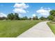 A lush community park features mature trees, benches, and walking paths at 20610 Maxim Pkwy, Orlando, FL 32833