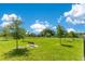 Beautiful community park features mature trees, grassy areas, and shaded benches at 20610 Maxim Pkwy, Orlando, FL 32833