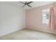 Bedroom with carpet, window, and pale pink walls at 2066 Cresswell St, Ocoee, FL 34761