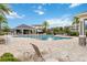 Resort-style community pool with ample seating, shaded pavilion, and palm trees for relaxation at 2066 Cresswell St, Ocoee, FL 34761