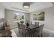 Well-lit dining room featuring modern decor, neutral tones, and a window view at 2066 Cresswell St, Ocoee, FL 34761