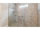 Modern tiled shower with glass enclosure and decorative accent tile at 2066 Cresswell St, Ocoee, FL 34761