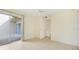 Bedroom featuring tile flooring and access to the outdoor lanai through sliding glass doors at 208 Sonora Drive # 208, Casselberry, FL 32707