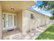 Charming front entryway with decorative glass door, enhanced by manicured landscaping at 208 Sonora Drive # 208, Casselberry, FL 32707