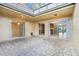 Enclosed lanai with skylights and brick flooring viewed from outdoor space at 208 Sonora Drive # 208, Casselberry, FL 32707