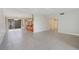 Open living room with tile flooring, seamlessly connected to the kitchen and dining areas at 208 Sonora Drive # 208, Casselberry, FL 32707