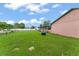 An expansive lawn is found in this backyard and is surrounded by a white fence and the home at 2309 Cilantro Dr, Orlando, FL 32837