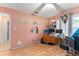 Bedroom with wood floor, ceiling fan and two-tone paint at 2309 Cilantro Dr, Orlando, FL 32837