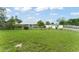 Charming single-story home with a well-maintained lawn and mature trees at 2309 Cilantro Dr, Orlando, FL 32837