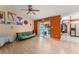 Open-concept living room with light wood flooring and sliding doors to the lanai at 2309 Cilantro Dr, Orlando, FL 32837