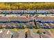 An aerial view showing the exteriors and screened-in patios of residential townhomes at 2460 Reading Trl, Kissimmee, FL 34746