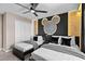Fun themed bedroom featuring two twin beds, dark wood furniture and an illuminated Mickey Mouse accent wall at 2460 Reading Trl, Kissimmee, FL 34746
