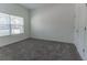 Bright, carpeted bedroom with natural light streaming through window, offering a calming and inviting space at 2460 Reading Trl, Kissimmee, FL 34746