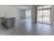 Open living area with tile flooring, sliding glass doors that offers great natural light and backyard access at 2460 Reading Trl, Kissimmee, FL 34746