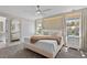 Inviting main bedroom with neutral tones, cozy textiles, and large windows for natural light at 2460 Reading Trl, Kissimmee, FL 34746