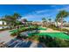 Community mini golf course with tropical palm trees and manicured landscaping at 2460 Reading Trl, Kissimmee, FL 34746