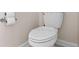 Toilet with decorative paper band in a neutral-toned bathroom at 2460 Reading Trl, Kissimmee, FL 34746