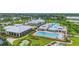 Aerial view of an amenity center featuring pools, walking paths, and recreational facilities at 2571 Yellow Brick Rd, St Cloud, FL 34772