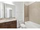 This bathroom boasts a tiled shower, granite countertops, and modern fixtures at 2571 Yellow Brick Rd, St Cloud, FL 34772