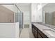 Modern bathroom featuring double sinks, granite countertop, tile floors and glass shower at 2571 Yellow Brick Rd, St Cloud, FL 34772