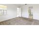 Cozy bedroom features a large window and an ensuite bathroom with a glass-enclosed shower at 2571 Yellow Brick Rd, St Cloud, FL 34772