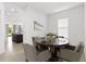 Modern dining room with round table and stylish chairs, perfect for intimate gatherings and meals at 2571 Yellow Brick Rd, St Cloud, FL 34772