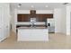 Bright kitchen features stainless steel appliances, granite countertops, and a large center island at 2571 Yellow Brick Rd, St Cloud, FL 34772