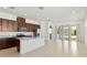 Bright open kitchen with stainless steel appliances, an island, and easy access to the backyard at 2571 Yellow Brick Rd, St Cloud, FL 34772