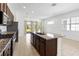 Spacious kitchen features granite countertops, stainless steel appliances, and ample counter space at 2571 Yellow Brick Rd, St Cloud, FL 34772