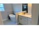 Modern bathroom with standalone tub, double vanity with quartz countertop, and gray tiled accent wall at 2579 Sw 146Th St, Ocala, FL 34473