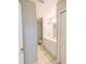 Bright bathroom features a white vanity with storage and a toilet in its own private area at 2816 Club Cortile Cir # A, Kissimmee, FL 34746