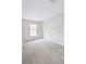 Clean and serene bedroom with neutral paint, carpet floors, and a window with blinds at 2816 Club Cortile Cir # A, Kissimmee, FL 34746