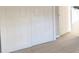 Spacious closet with bi-fold doors and shelves, and hardwood-style flooring at 2816 Club Cortile Cir # A, Kissimmee, FL 34746