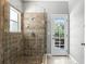 Bathroom's tiled glass shower and backyard access offer a luxurious and convenient experience at 2890 Wild Ginger Ct, Winter Park, FL 32792