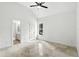 Bright bedroom featuring vaulted ceilings, a ceiling fan, and marble floors at 2890 Wild Ginger Ct, Winter Park, FL 32792