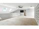 Spacious bonus room with built-in shelves and skylights for ample natural light at 2890 Wild Ginger Ct, Winter Park, FL 32792