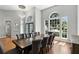 Bright dining room with hardwood floors, high ceilings, large windows, and a modern chandelier at 2890 Wild Ginger Ct, Winter Park, FL 32792