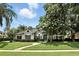 Charming single-story home with a well-manicured lawn, lush landscaping, and a welcoming front entrance at 2890 Wild Ginger Ct, Winter Park, FL 32792