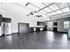 Spacious garage with epoxy floors, ample storage cabinets, and overhead lighting at 2890 Wild Ginger Ct, Winter Park, FL 32792