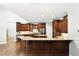 Bright, updated kitchen with granite countertops, stainless steel appliances, and custom wooden cabinets and island at 2890 Wild Ginger Ct, Winter Park, FL 32792