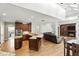 Gourmet kitchen with granite countertops, custom cabinets, and stainless steel appliances adjacent to a spacious living area at 2890 Wild Ginger Ct, Winter Park, FL 32792