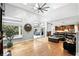 Bright living room with hardwood floors, high ceilings, and access to the outdoor living space at 2890 Wild Ginger Ct, Winter Park, FL 32792