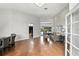Open-concept living room with hardwood floors, high ceilings, and views of the outdoor patio at 2890 Wild Ginger Ct, Winter Park, FL 32792