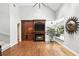 Spacious living room with high ceilings, a built-in entertainment center, and a cozy fireplace at 2890 Wild Ginger Ct, Winter Park, FL 32792