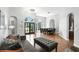 Spacious living area with hardwood floors, high ceilings, ample natural light, and formal dining area at 2890 Wild Ginger Ct, Winter Park, FL 32792