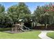 Community playground with slides, swings, and a picnic area for Gathering fun at 2890 Wild Ginger Ct, Winter Park, FL 32792