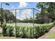 Community tennis court surrounded by lush greenery and landscaping at 2890 Wild Ginger Ct, Winter Park, FL 32792