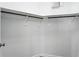 Empty walk-in closet with white walls, a wood floor, and hanging racks ready for storage at 2890 Wild Ginger Ct, Winter Park, FL 32792