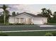 Charming one-story home with well-manicured lawn, stone accents and an attached two car garage at 3004 Water Clover Ct, Apopka, FL 32712