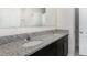 Bathroom vanity with granite countertop and dual sinks at 3110 Areca Ave, New Smyrna Beach, FL 32168
